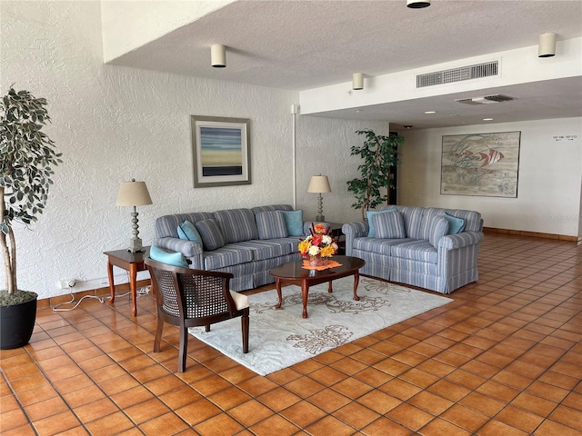 tiled living room with a textured ceiling