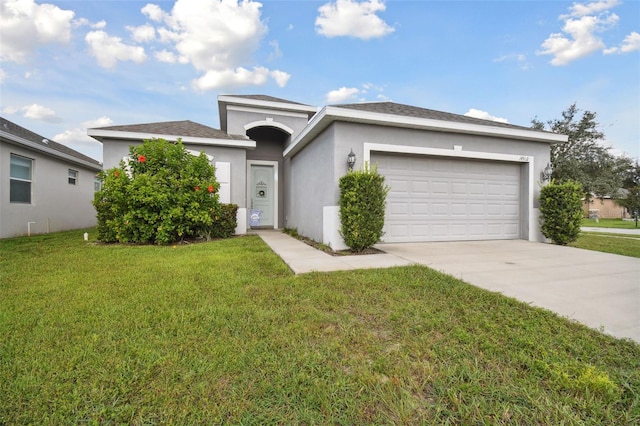 view of front of home featuring a garage and a front yard