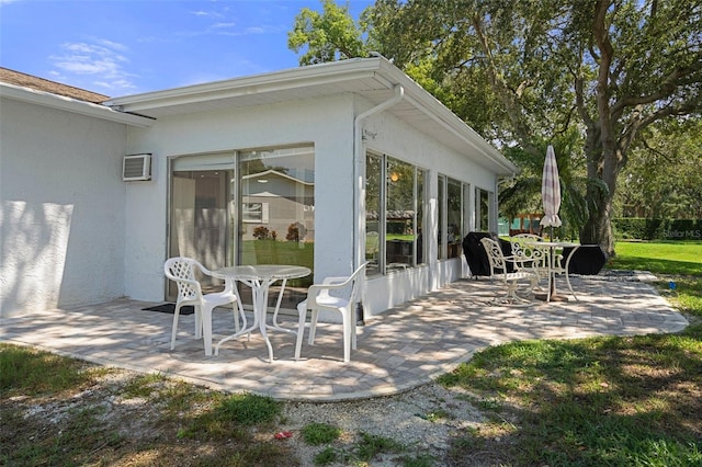 view of patio / terrace featuring a wall mounted air conditioner