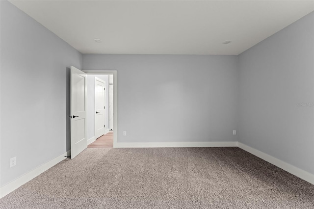 unfurnished room with carpet flooring