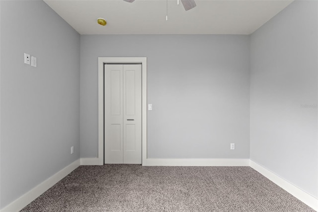 carpeted empty room with ceiling fan