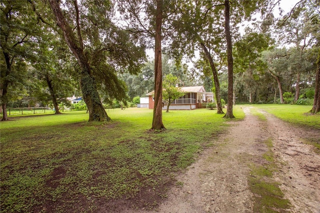 view of yard featuring a sunroom