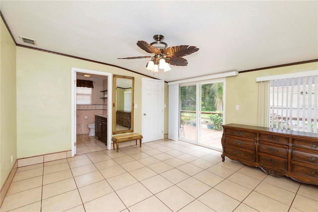 interior space with a textured ceiling, crown molding, and ceiling fan