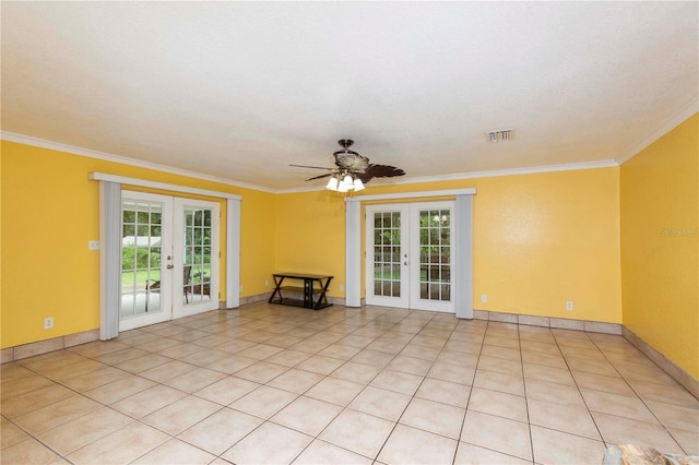 spare room with ornamental molding, a ceiling fan, visible vents, and french doors