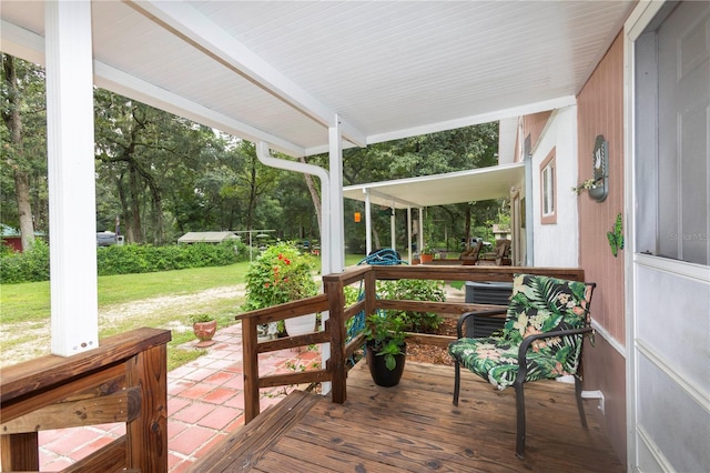 wooden deck with a yard