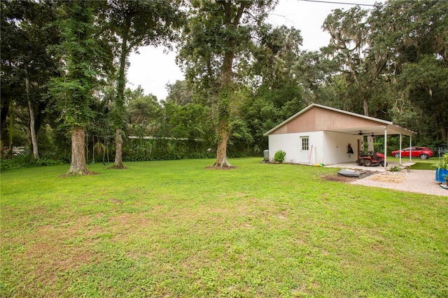 view of yard with a carport