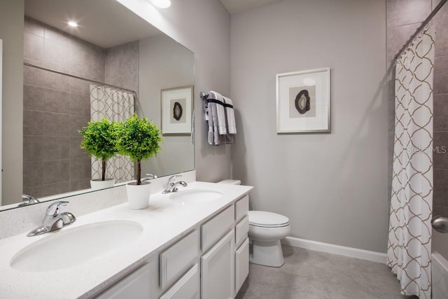 bathroom featuring concrete flooring, a shower with curtain, vanity, and toilet