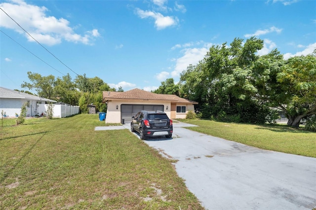 view of front of home featuring a garage and a front yard