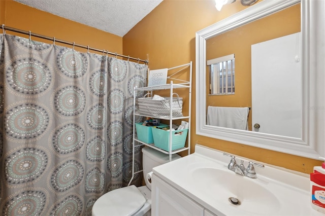 bathroom with a textured ceiling, vanity, toilet, and a shower with curtain