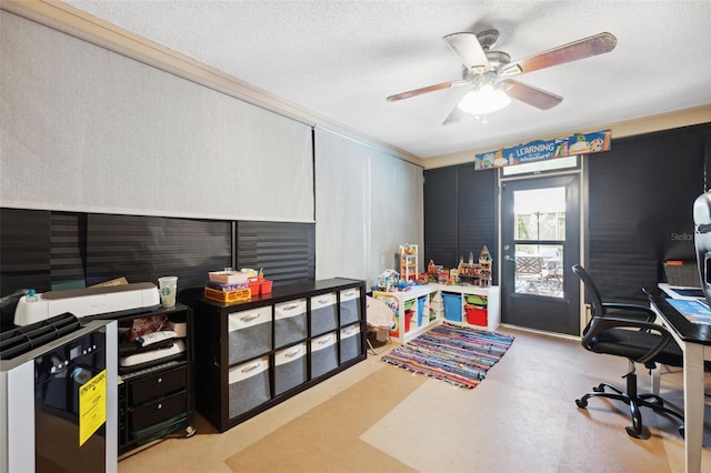 office area with ceiling fan and a textured ceiling