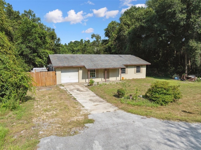 365 S Snapp Ave, Inverness, FL 34453 - ranch-style home with an attached garage, covered porch, fence, a front yard, and driveway