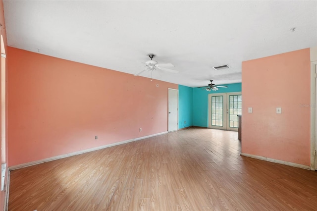 unfurnished room featuring light hardwood / wood-style flooring and ceiling fan