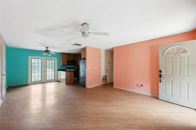365 S Snapp Ave, Inverness, FL 34453 - unfurnished living room featuring visible vents, light wood-style flooring, baseboards, and ceiling fan