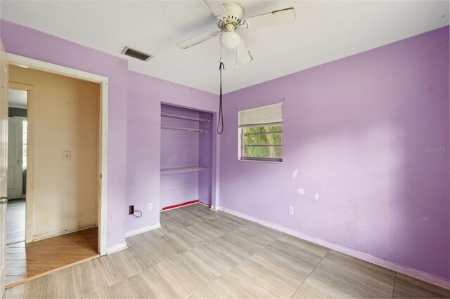 365 S Snapp Ave, Inverness, FL 34453 - unfurnished bedroom featuring a ceiling fan, a closet, baseboards, and visible vents