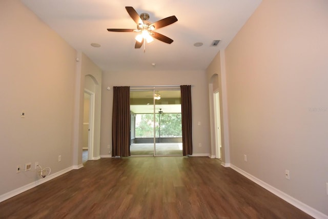 spare room featuring ceiling fan and dark hardwood / wood-style flooring