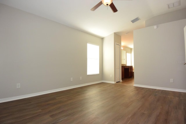 unfurnished room with ceiling fan, lofted ceiling, and dark hardwood / wood-style floors