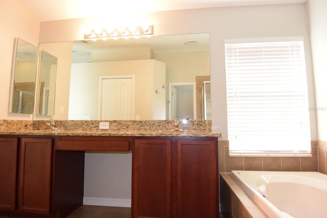 bathroom with vanity and plus walk in shower