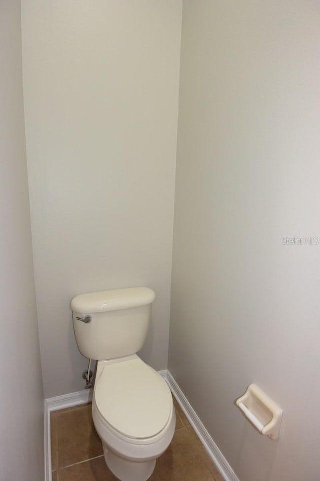 bathroom with tile patterned floors and toilet