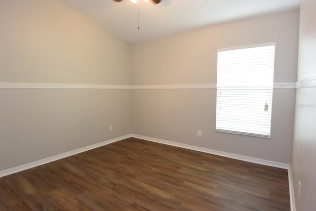 spare room with ceiling fan and dark hardwood / wood-style flooring