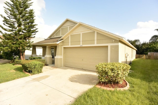 view of front facade featuring a garage and a front lawn