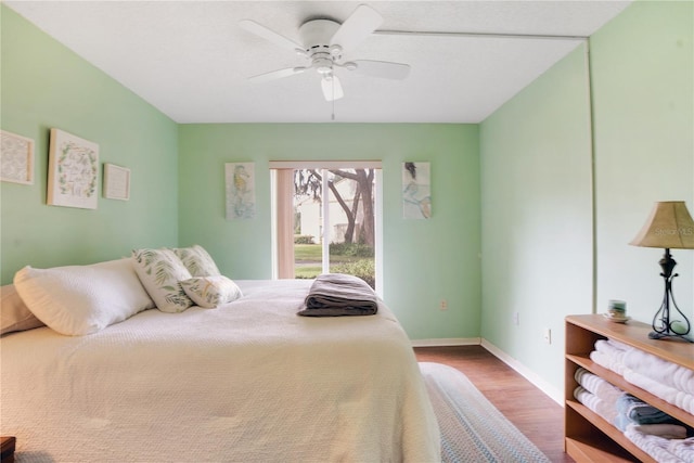 bedroom with wood-type flooring and ceiling fan