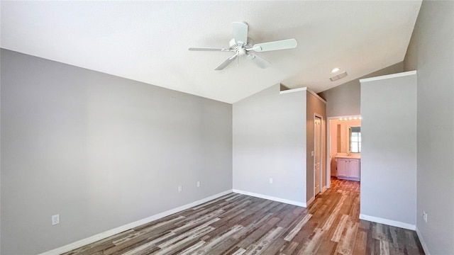 unfurnished room featuring vaulted ceiling, wood-type flooring, and ceiling fan