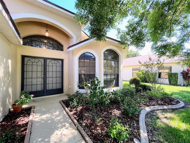 property entrance featuring french doors