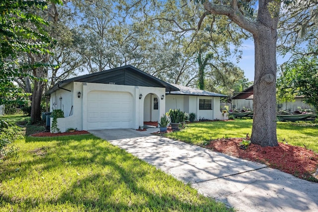 ranch-style house with a front lawn and a garage