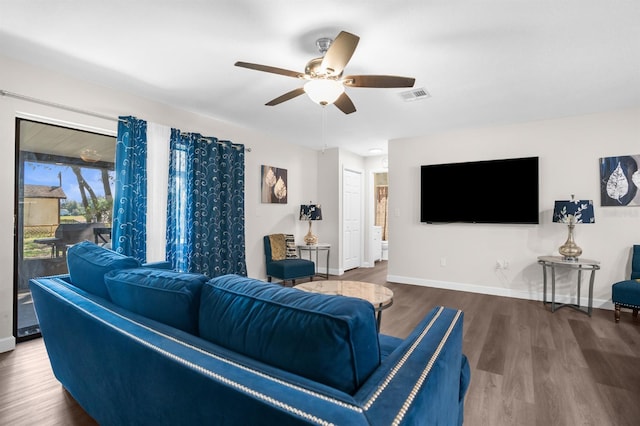 living room with hardwood / wood-style floors and ceiling fan