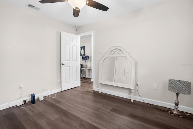 bedroom with ceiling fan and dark hardwood / wood-style floors