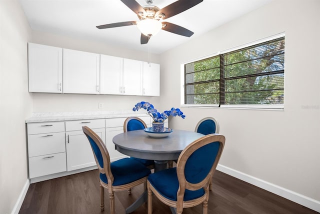 dining space featuring dark hardwood / wood-style flooring and ceiling fan