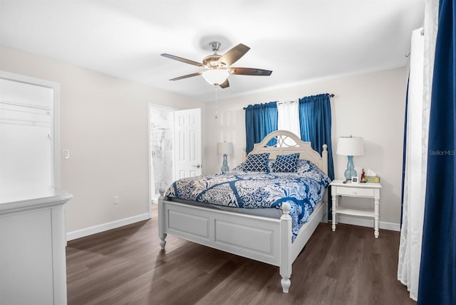 bedroom featuring dark hardwood / wood-style floors, ceiling fan, and ensuite bathroom