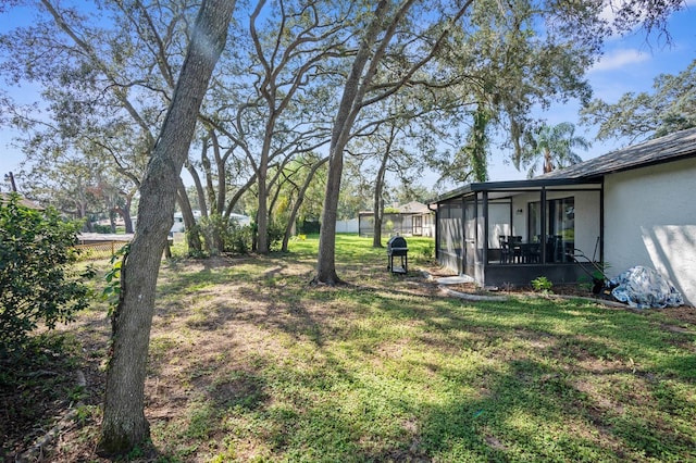 view of yard with a sunroom