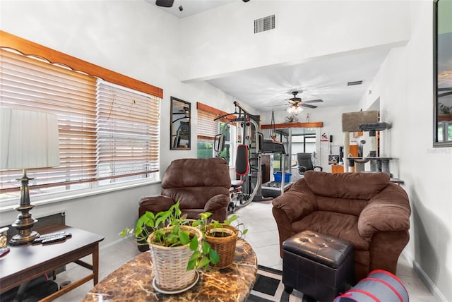 living room featuring ceiling fan and a wealth of natural light