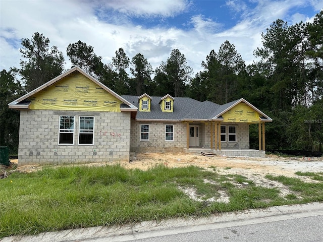 property in mid-construction featuring covered porch