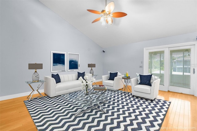 living room featuring ceiling fan, hardwood / wood-style flooring, and high vaulted ceiling