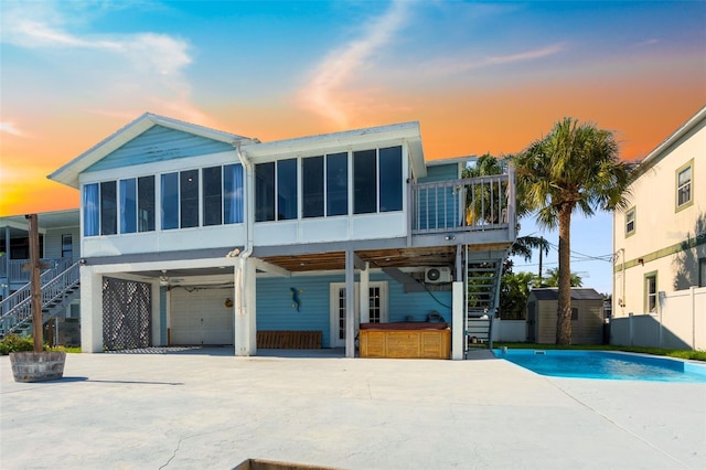 view of front of property featuring a sunroom