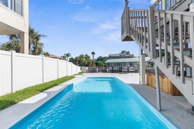 view of swimming pool with a patio area