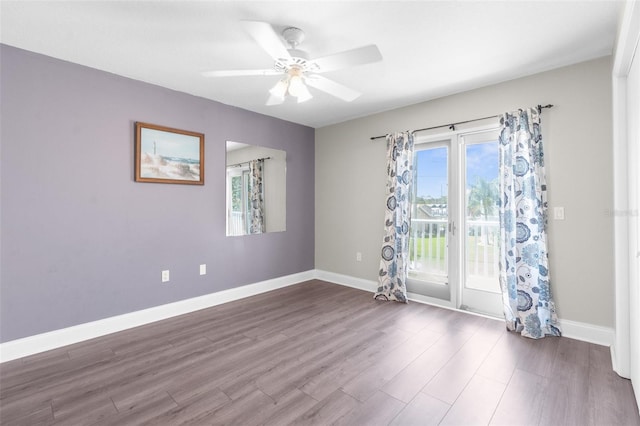 unfurnished room with ceiling fan and hardwood / wood-style flooring