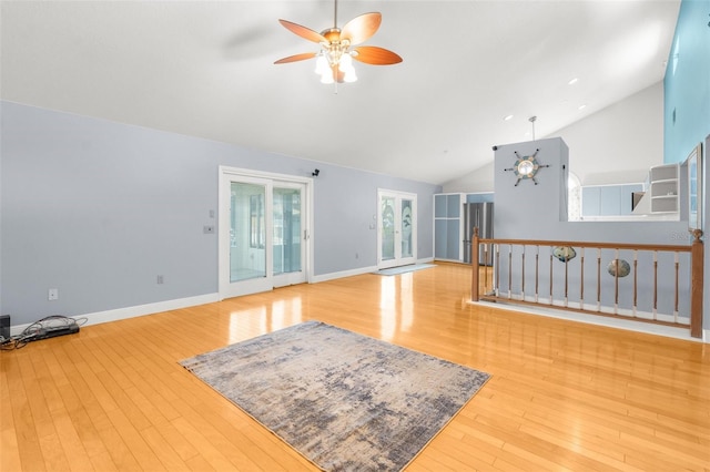 living room featuring high vaulted ceiling, light wood-type flooring, and ceiling fan