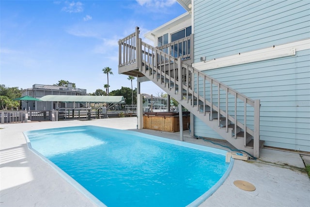 view of swimming pool with a patio