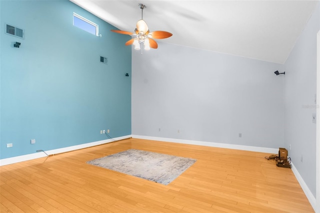 spare room with ceiling fan and light wood-type flooring