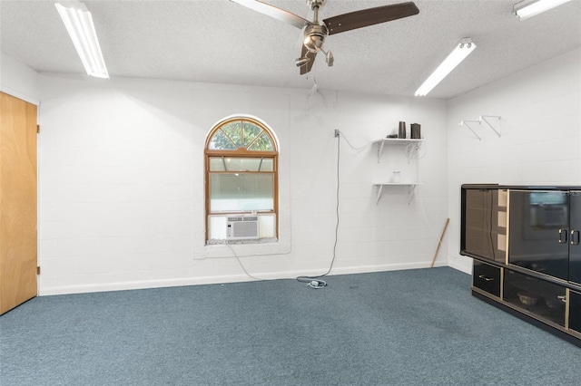 interior space featuring ceiling fan, a textured ceiling, and carpet flooring