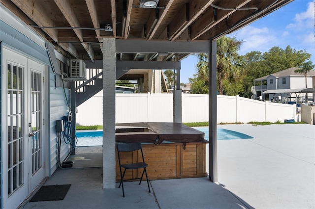 view of patio featuring a pool with hot tub