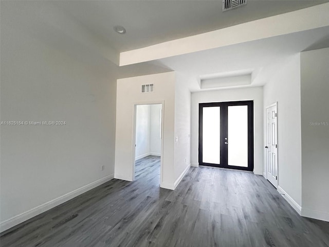 foyer featuring dark hardwood / wood-style flooring and french doors