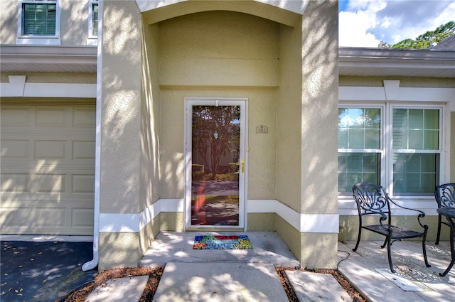 entrance to property featuring a garage