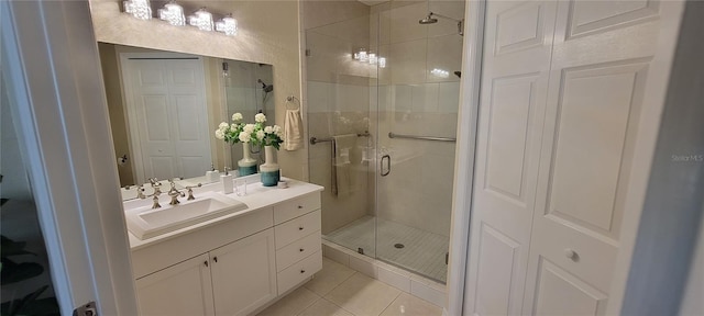 bathroom featuring vanity, an enclosed shower, and tile patterned floors