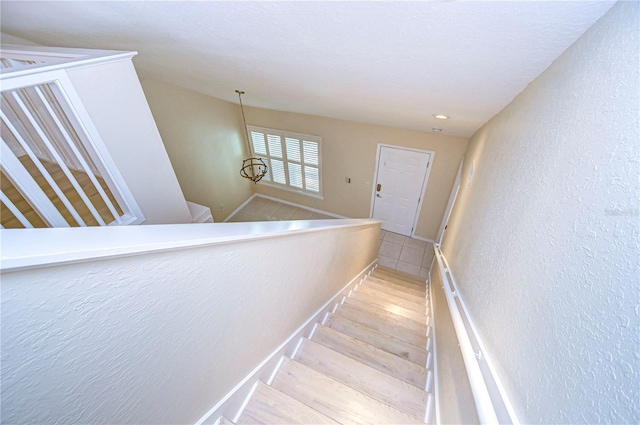 stairs featuring hardwood / wood-style flooring