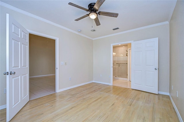 empty room featuring ornamental molding, ceiling fan, and light hardwood / wood-style floors