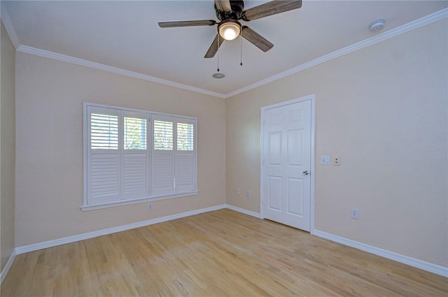 empty room featuring crown molding, ceiling fan, and light wood-type flooring